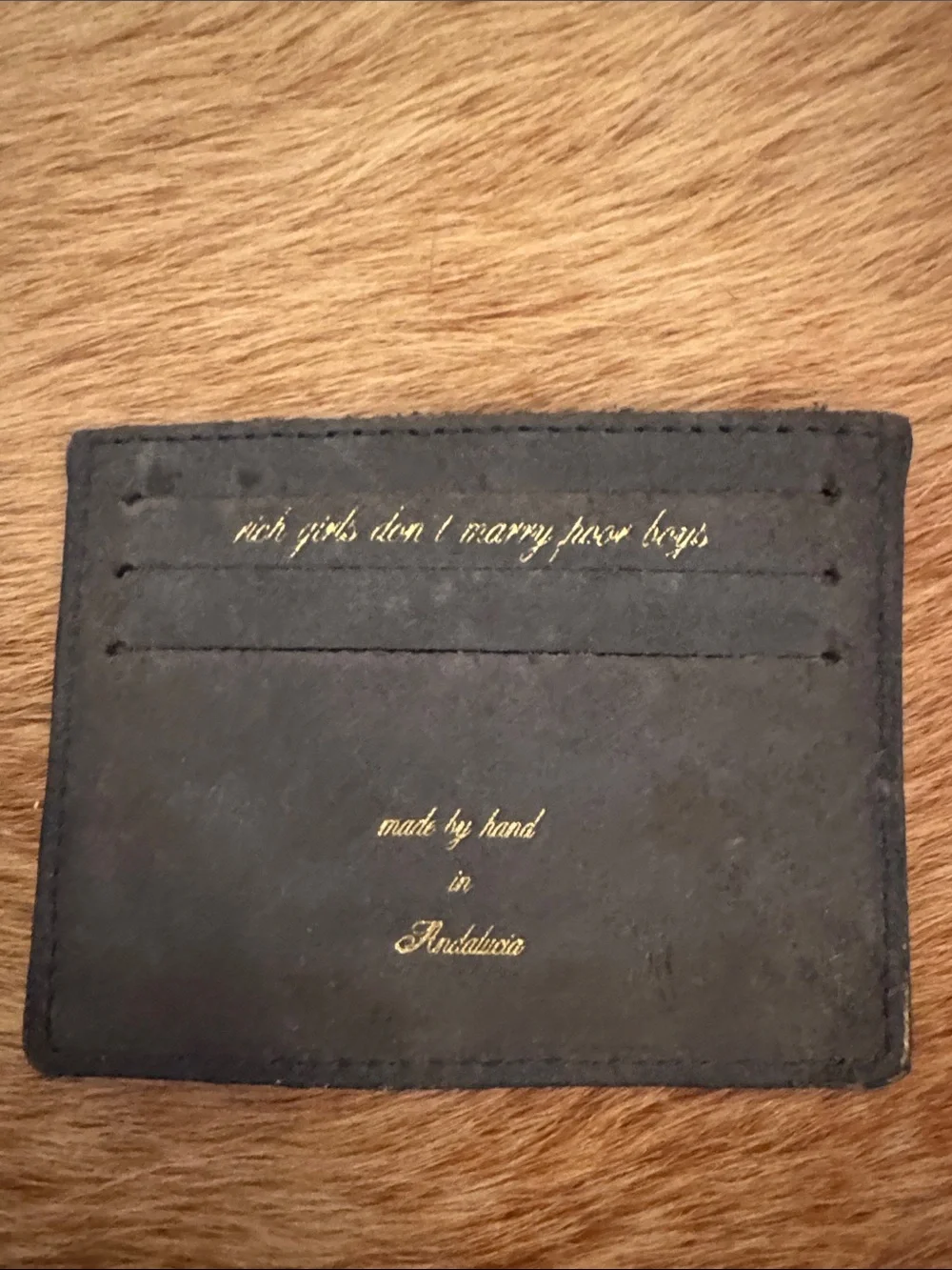 n.d.c. black leather card holder with gold foil logo